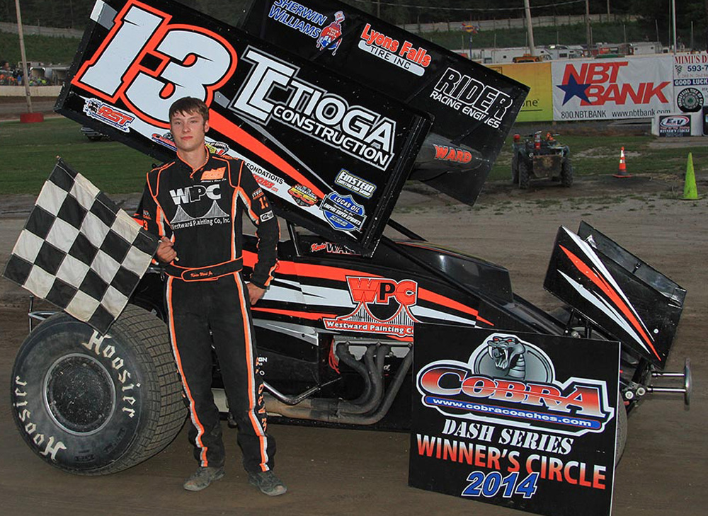 This July 5, 2014 photo provided by Empire Super Sprints, Inc., shows sprint car driver Kevin Ward Jr., in the victory lane with his car at the Fulton Speedway in Fulton, N.Y.