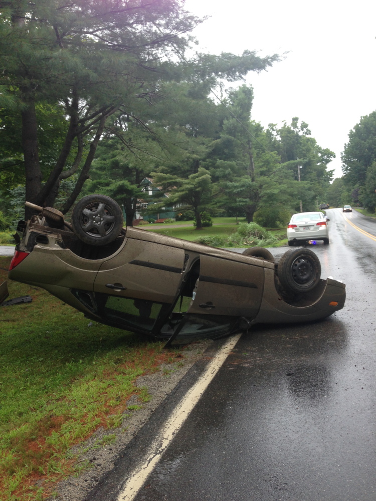 Jacob Collins, 19, of Sidney suffered a possible concussion when his car flipped over on West River Road in Sidney on Wednesday afternoon.