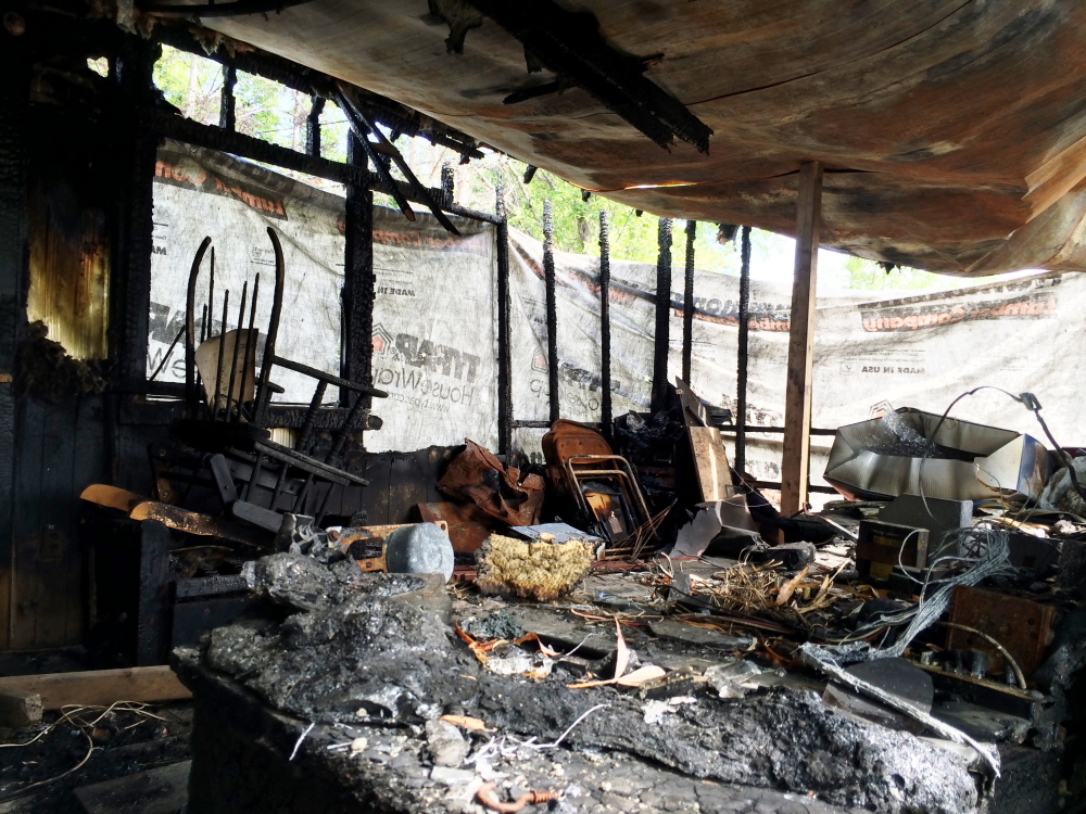 Gutted interior of a Farmington mobile home damaged by a March fire. Selectmen have ordered the strucure torn down by mid-October.