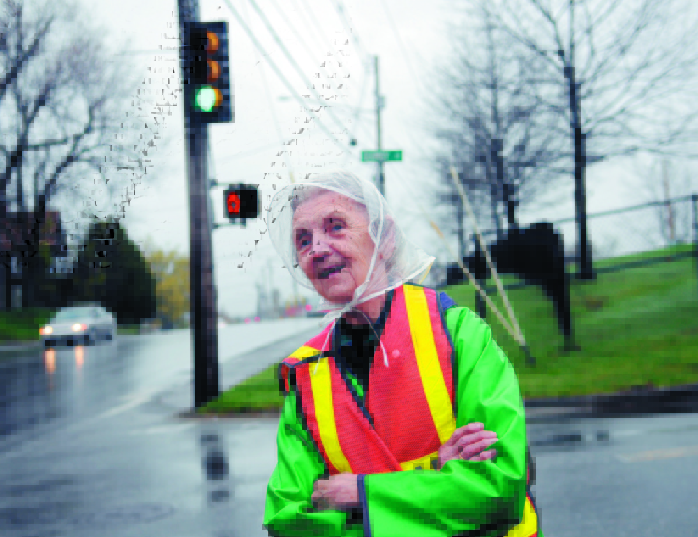 In this 2011 file photo, Lorraine Bilodeau looks for elementary school students approaching the intersection of School and Bangor streets in Augusta, where she was a crossing guard.