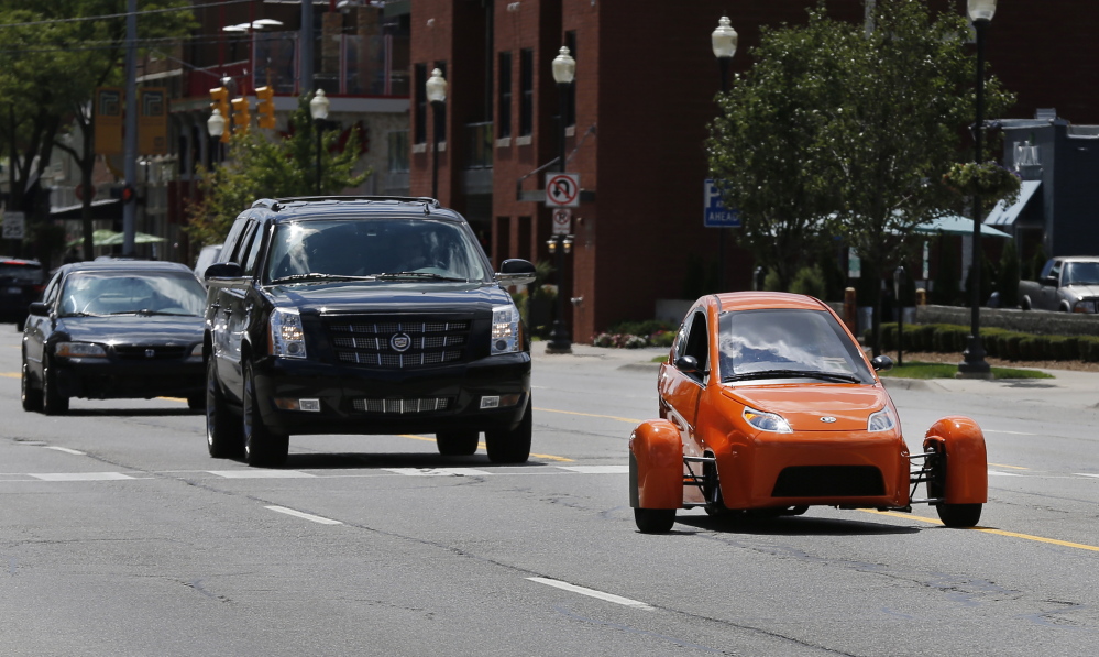 The Associated Press
Instead of spending $20,000 on a new car, Paul Elio is offering commuters a cheaper option to drive to work. His three-wheeled vehicle The Elio will sell for $6,800 car and can save on gas with fuel economy of 84 mpg.