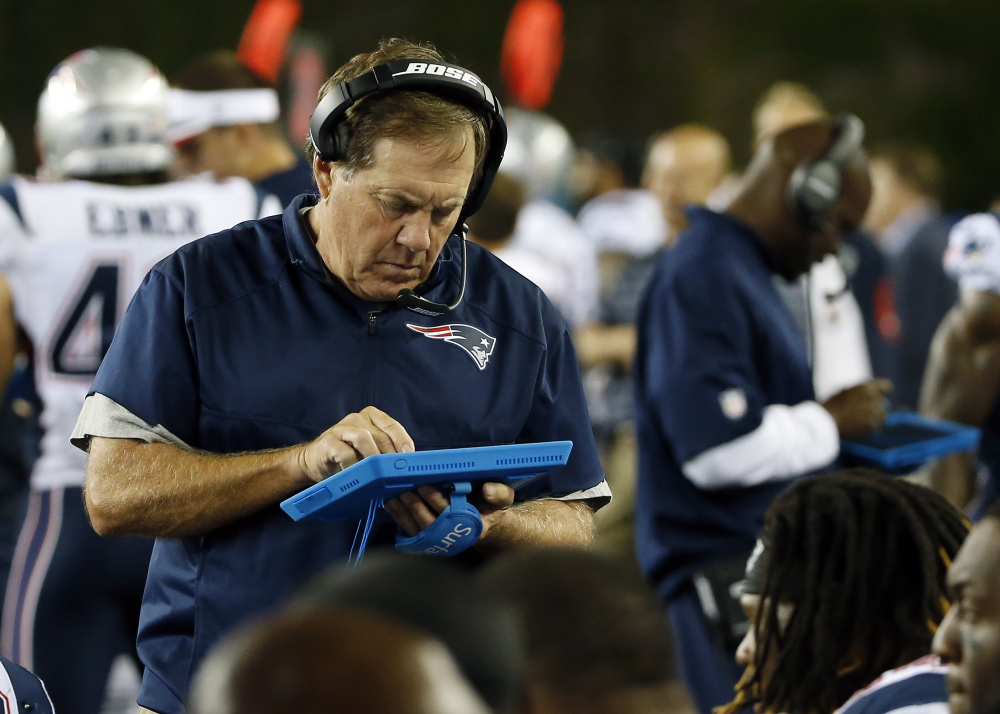 Patriots Coach Bill Belichick, who is using a tablet on the sideline in Friday’s game against the Philadelphia Eagles, was penalized for unsportsmanlike conduct for arguing, in vain, against a penalty on the Eagles.