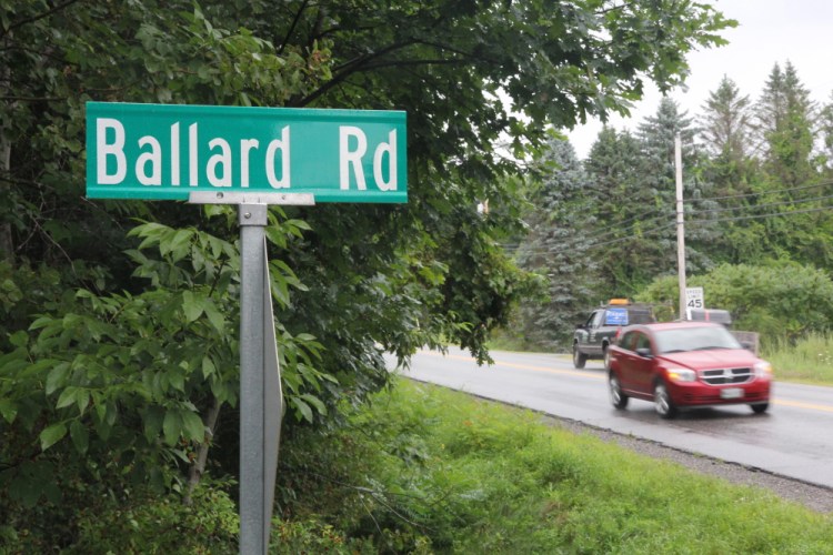 Motorists on Old Belgrade Road in Augusta drive past Ballard Road on Friday. The City Council is considering a proposal to change the name of the road to Jeff Gagnon Road. Gagnon, who grew up on the road, was murdered in 1989.