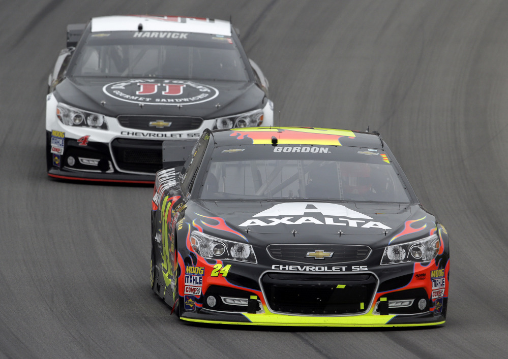 Jeff Gordon (24) races Kevin Harvick during the NASCAR Sprint Cup Series Pure Michigan 400 auto race at Michigan International Speedway in Brooklyn, Mich., Sunday.