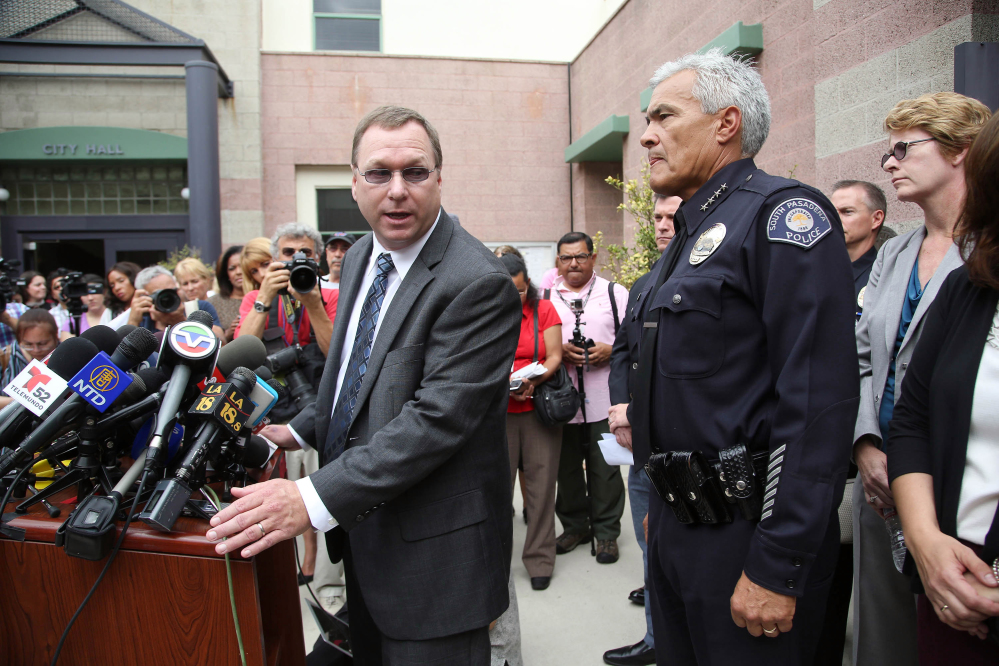 South Pasadena, Calif., Police Chief Arthur Miller, right, and South Pasadena Unified School District Superintendent Dr. Geoff Yanz announce Tuesday that police had arrested two South Pasadena High School students suspected of planning a massacre at the school.