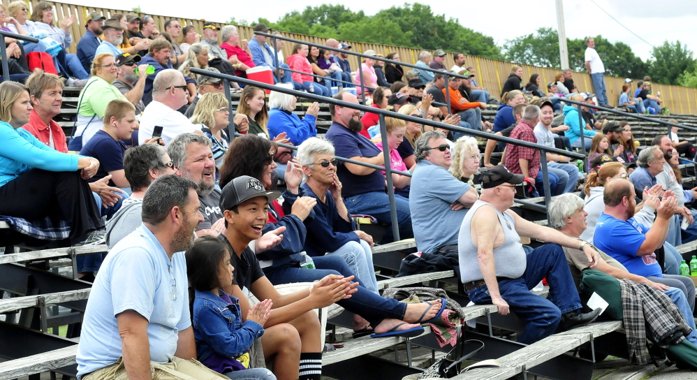 Spectators clap for winners of a race at the Unity Raceway in Unity on Sunday.