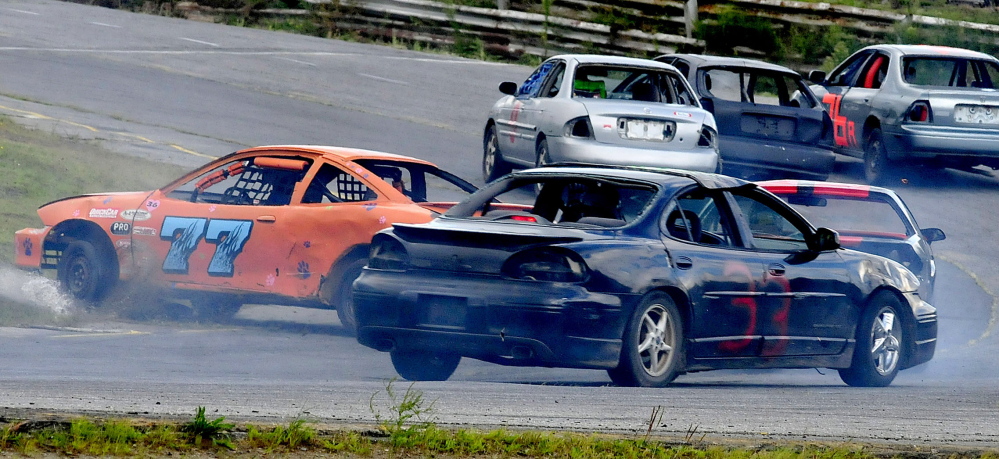 Car number 77 spins out at a turn during races at Unity Raceway on Sunday, Aug. 17, 2014. (Photo by David Leaming/Staff Photographer)