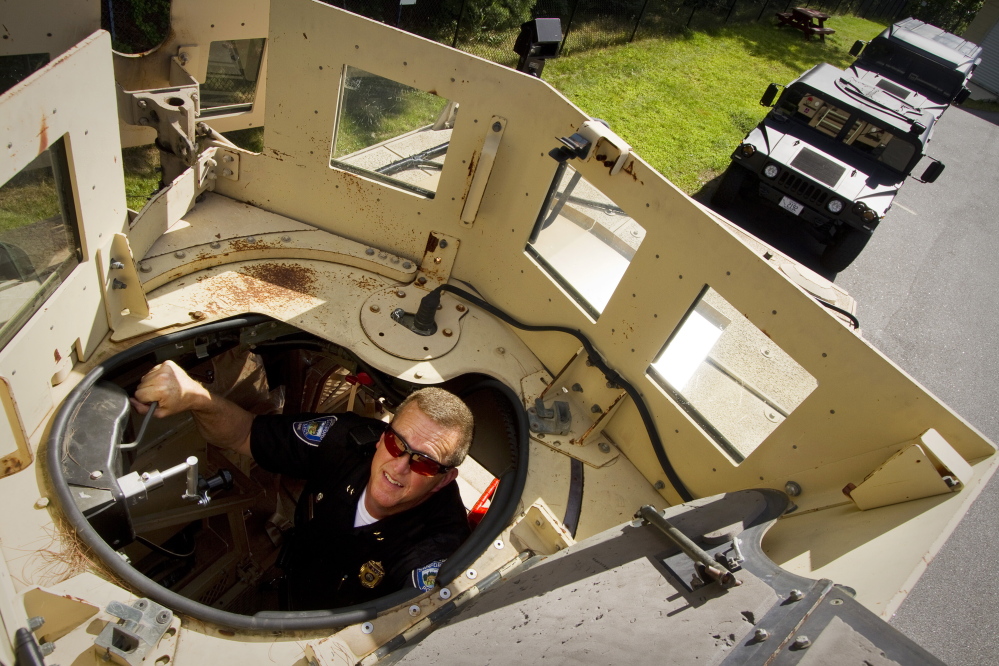 Sanford Police Chief Thomas Connolly looks through the roof hatch of his department’s Mine-Resistant Ambush Protected (MRAP) vehicle on Tuesday in Sanford.