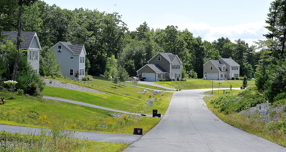 Homes stand on winding Thrush Terrace in Windham. Buyers can get more house for their money here than in nearby towns, and the demand for larger houses is growing.
