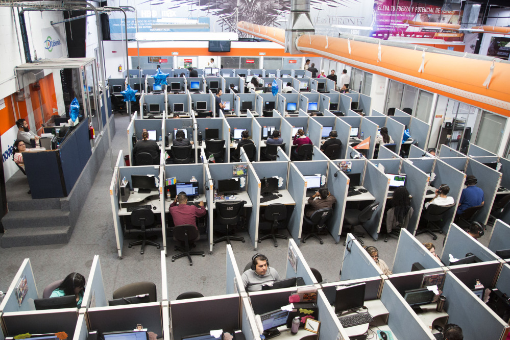 Many Mexicans deported under U.S. President Barack Obama are finding employment in call centers such as the Firstkontact Center, a call center in the northern border city of Tijuana, Mexico.
