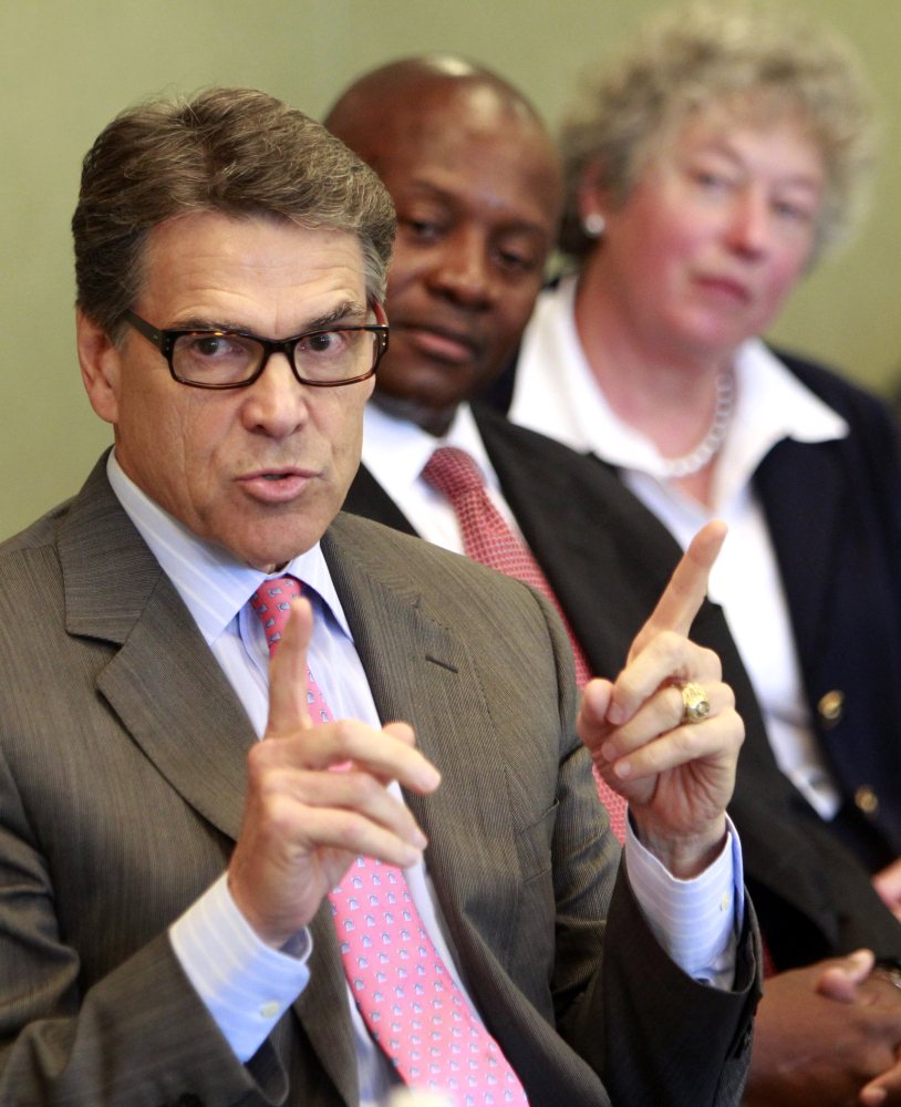 Texas Gov. Rick Perry speaks to a group of business leaders Friday in Portsmouth, N.H.