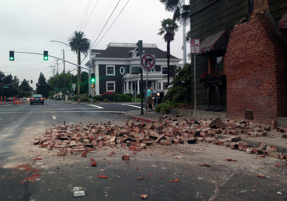 Bricks are in the street after a building was damaged during an earthquake in Napa, Calif., on Sunday.