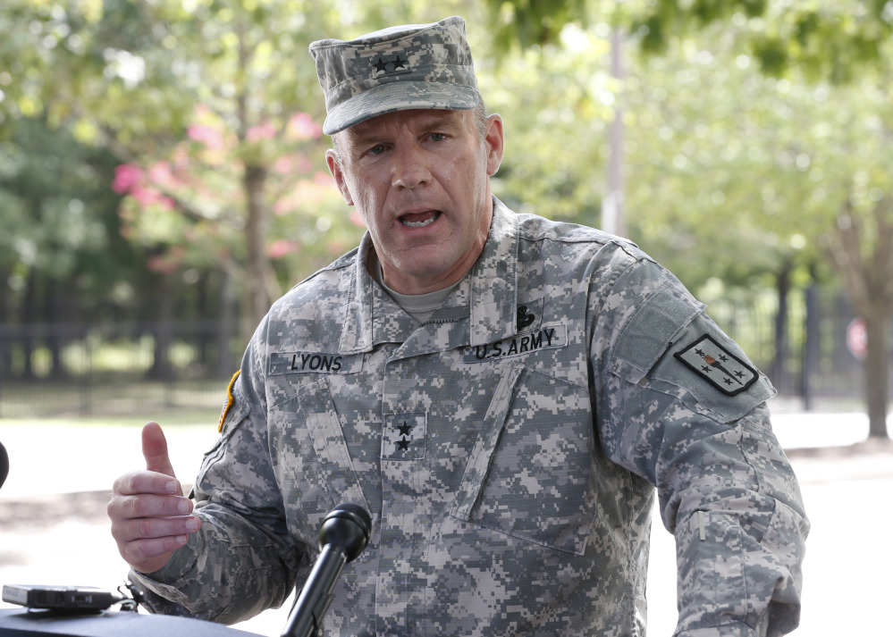 Army Major General Stephen Lyons speaks during a news conference at the base in Fort Lee, Va., Monday.  A female soldier with a gun inside a key building at a Virginia Army base turned the weapon on herself, causing an injury, but didn’t wound any others as the heavily trafficked base temporarily went on lockdown Monday morning.