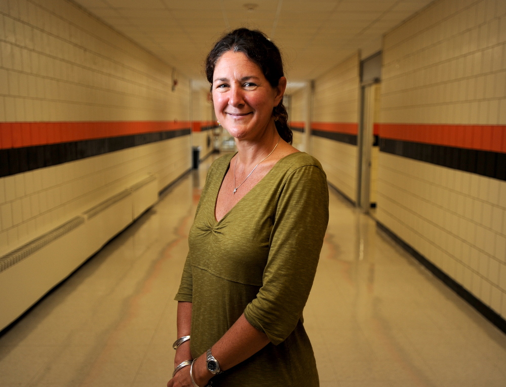 Monique Poulin is the new Skowhegan Area High School principal. Poulin stands in a hallway at Skowhegan Area High School just before the beginning of her first year as principal.