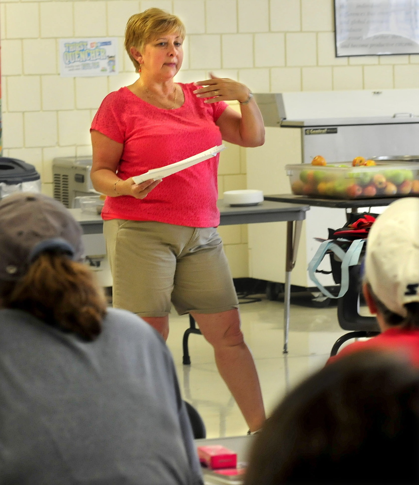 Laura Pineo, director of SAD 54 food services, speaks to the school district’s nutrition employees in preparation for the opening of the school year, when all sudents in the district’s seven schools will be eligible for free breakfast and free lunch.