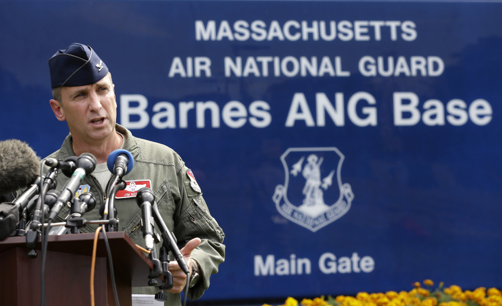 U.S. Air National Guard Col. James Keefe, commander of the 104th Fighter Wing, takes questions from reporters in front of Barnes Air National Guard Base, in Westfield, Mass., on Wednesday about a crashed Massachusetts Air National Guard F-15C fighter.