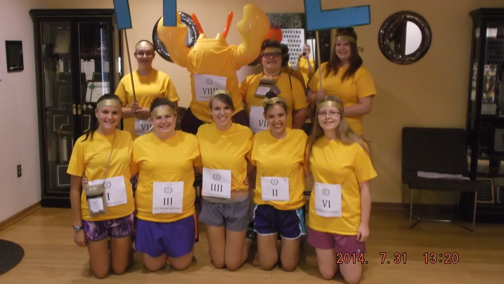 The Maine delegation prepares for the Race Atalanta for the Purple and Gold spirit competition at the 2014 National Junior Classical League Convention. Front, from left, are Siana Emery, Emily Mitchell, Laura Rose, Alexis Elder and Kathryn Truman; and back, from left, are Dakota Jackson, mascot Lobster Stu, Teresa Easterbrooks and Sarah Truman.