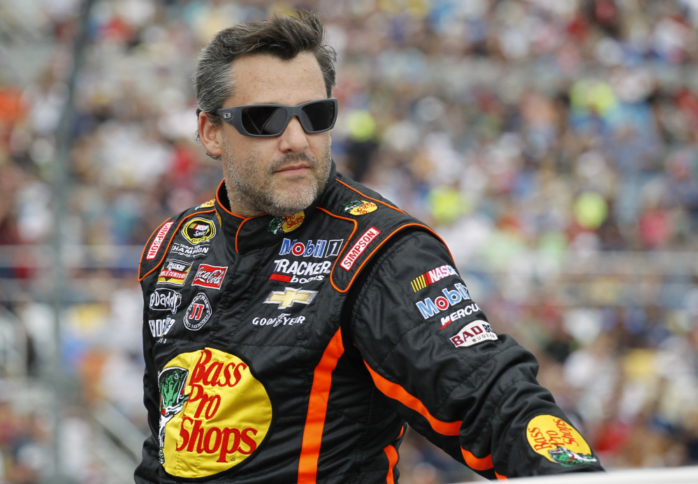 In this Feb. 2014 photo, Tony Stewart is introduced before the NASCAR Daytona 500 Sprint Cup series auto race at Daytona International Speedway in Daytona Beach, Fla. Stewart will return to Sprint Cup competition Sunday night at Atlanta Motor Speedway, ending a three-race hiatus taken after he struck and killed a fellow driver during a dirt-track race.