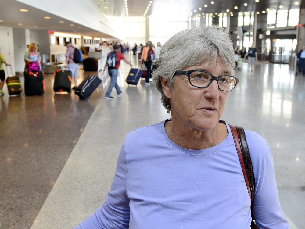 Leslie Thurston, of Seattle, is among travelers at Portland International Jetport who gave their views Tuesday about quarrels between passengers who want to recline their seats and passengers behind them who object to it.