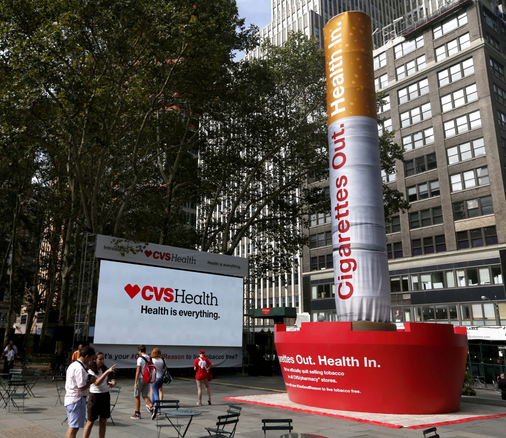 An inflatable cigarette is displayed in New York on Wednesday to coincide with CVS’ announcement to change its name and stop selling tobacco products.