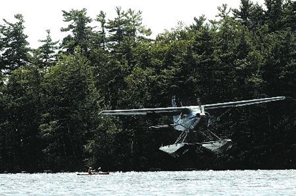 Staff file photo by Jeff Pouland
A float plane piloted by Bill McKay of Oakland approaches the water while making a landing on Messalonskee Lake in Oakland in August, 2006. A float plane piloted by McKay crashed in Quebec Tuesday. McKay died in the crash while an adult son and daughter survived.
