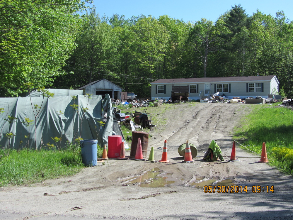 This property on North Wayne Avenue, Wayne, is the subject of a civil lawsuit in Kennebec County Superior Court. The town is asking a court to fine property owner Earle Welch Jr.; to order him to clean it up within 30 days; and, if he fails to do so, to allow the town to do the cleanup and bill him.