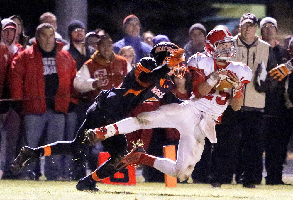 Portland Press Herald file photo by Gabe Souza 
 Cony wide receiver Tayler Carrier hauls in a touchdown pass during an Eastern B playoff game against Brunswick last season. Carrier and the Rams are set to begin their Class B title defense Friday night against Messalonskee.
