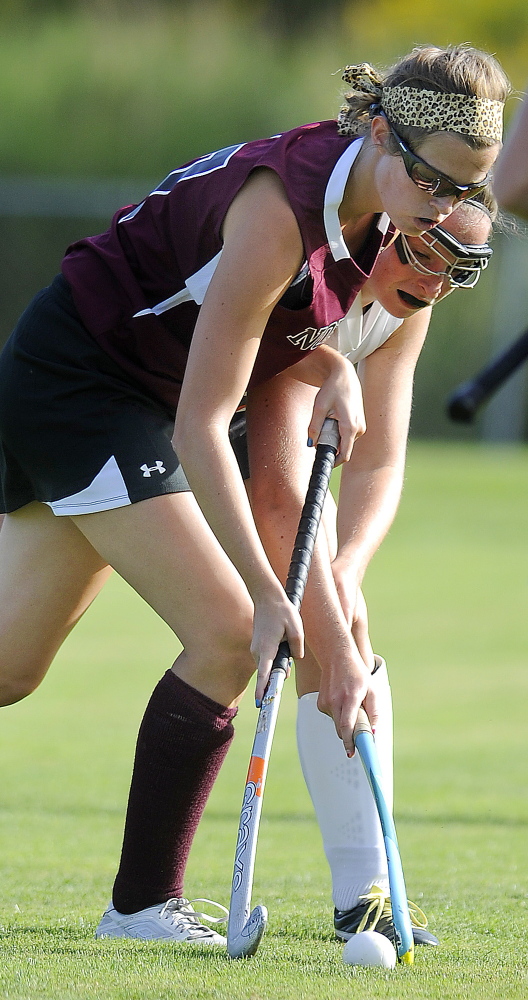 GARDINER, ME - SEPTEMBER: Gardiner Area High School's Emily Michaud, right, contains Thursday September 4, 2014 past Nokomis High School's Olivia Brown during a field hockey match up in Gardiner. (Photo by Andy Molloy/Staff Photographer)