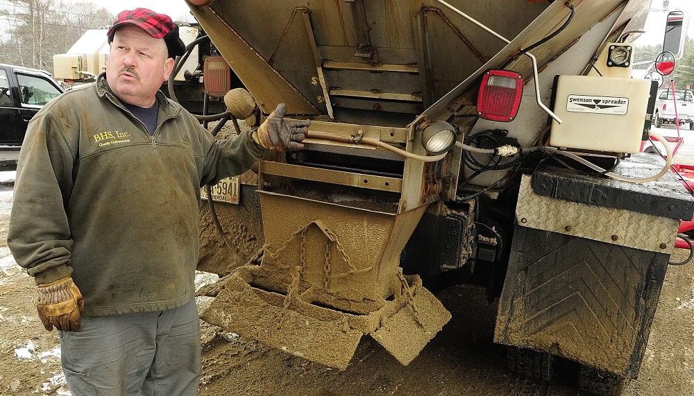 Chris Ellis talks about the calcium chloride dispensers on his plow trucks in this December 2013 file photo at Ellis Construction in Farmingdale.