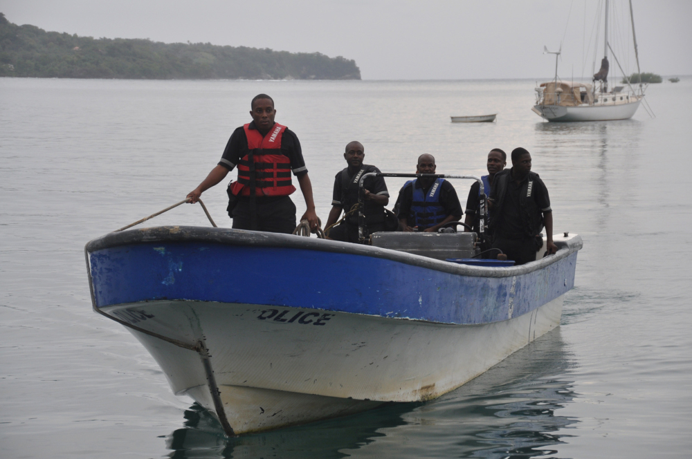 Jamaican Marine Police return to the Port Antonio Marina after a fruitless search for a plane that crashed into the ocean near Port Antonio, Jamaica, on Friday.