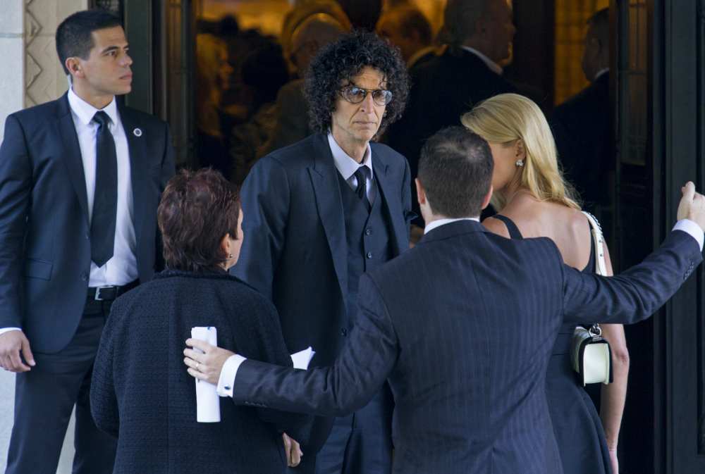 Howard Stern, center, arrives at a funeral service for comedian Joan Rivers at Temple Emanu-El in New York on Sunday.