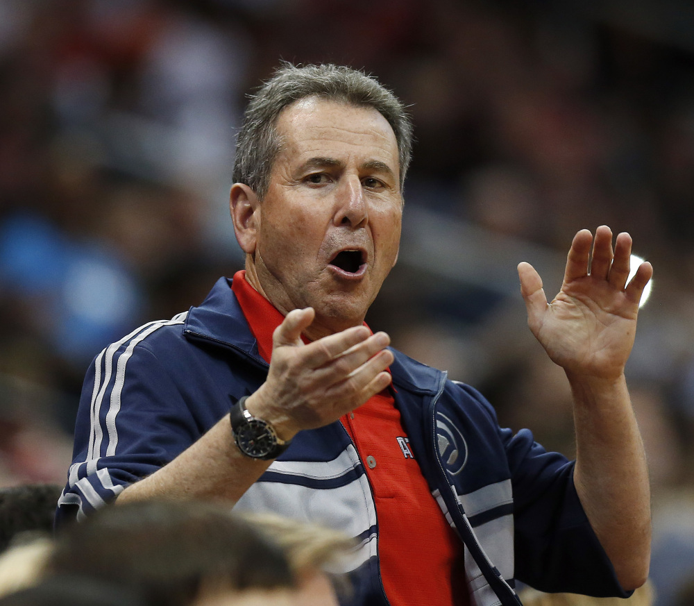 FILE - In this April 26, 2014, file photo, Atlanta Hawks co-owner Bruce Levenson cheers from the stands in the second half of Game 4 of an NBA basketball first-round playoff series against the Indiana Pacers in Atlanta. Levenson said Sunday, Sept. 7, 2014, he is selling his controlling interest in the team, in part due to an inflammatory email he said he wrote in an attempt "to bridge Atlanta's racial sports divide." (AP Photo/John Bazemore, File)