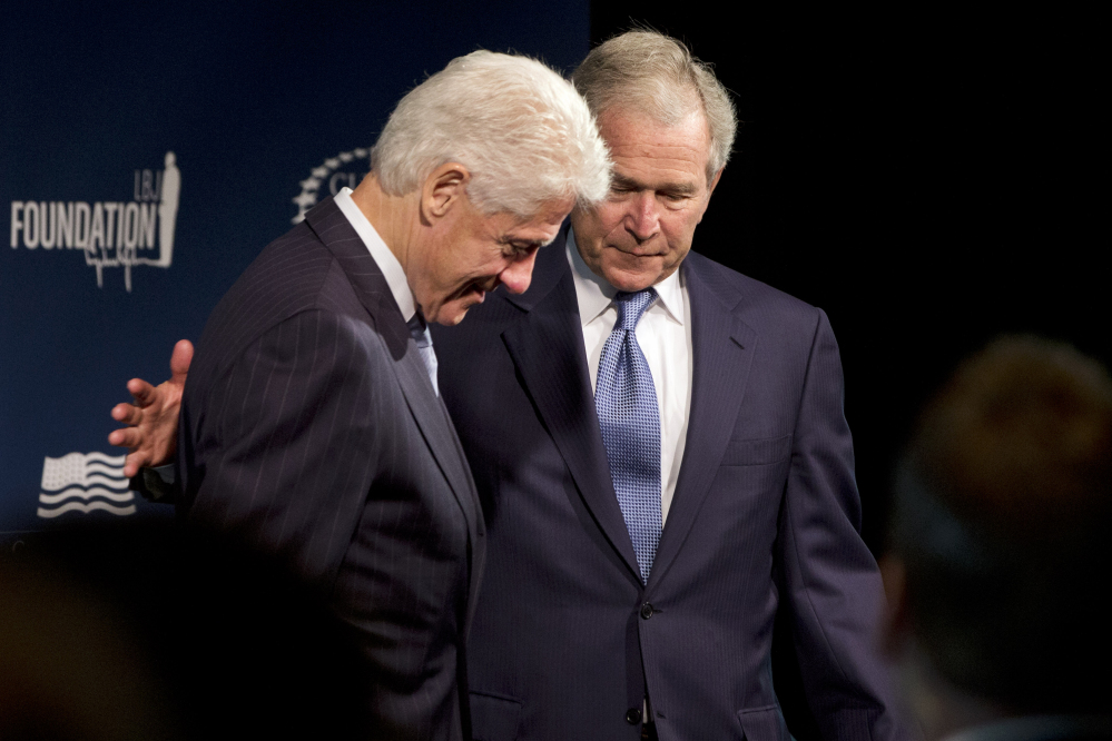 Former Presidents Bill Clinton, left, and George W. Bush participate in the Presidential Leadership Scholars Program launch on Monday at The Newseum in Washington.