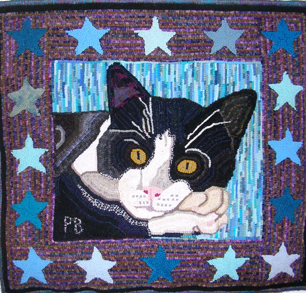 “Cat with Stars,” a hooked rug by Paula Benne is among the artwork on display at the Fire Station on Saturday during Whitefield Community Days.