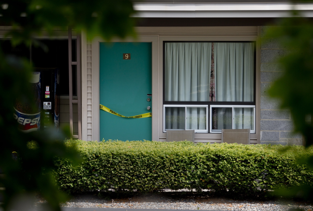 Crime scene tape drapes a door at the Sleepy Hollow Motel in Biddeford on Wednesday after police recovered two bodies Tuesday night. The victims were Daniel Pelletier, 28, and Lynda Norton, 31, both of Biddeford.
