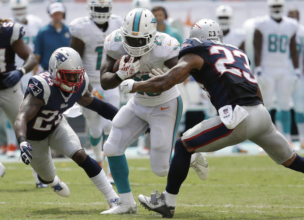 The New England Patriots allowed Miami Dolphins running back Knowshon Moreno (28) to rush for 191 yards during the Dolphins’s 33-20 win. The Patriots don’t have an easier task this week when they play Adrian Peterson and the Minnesota Vikings.