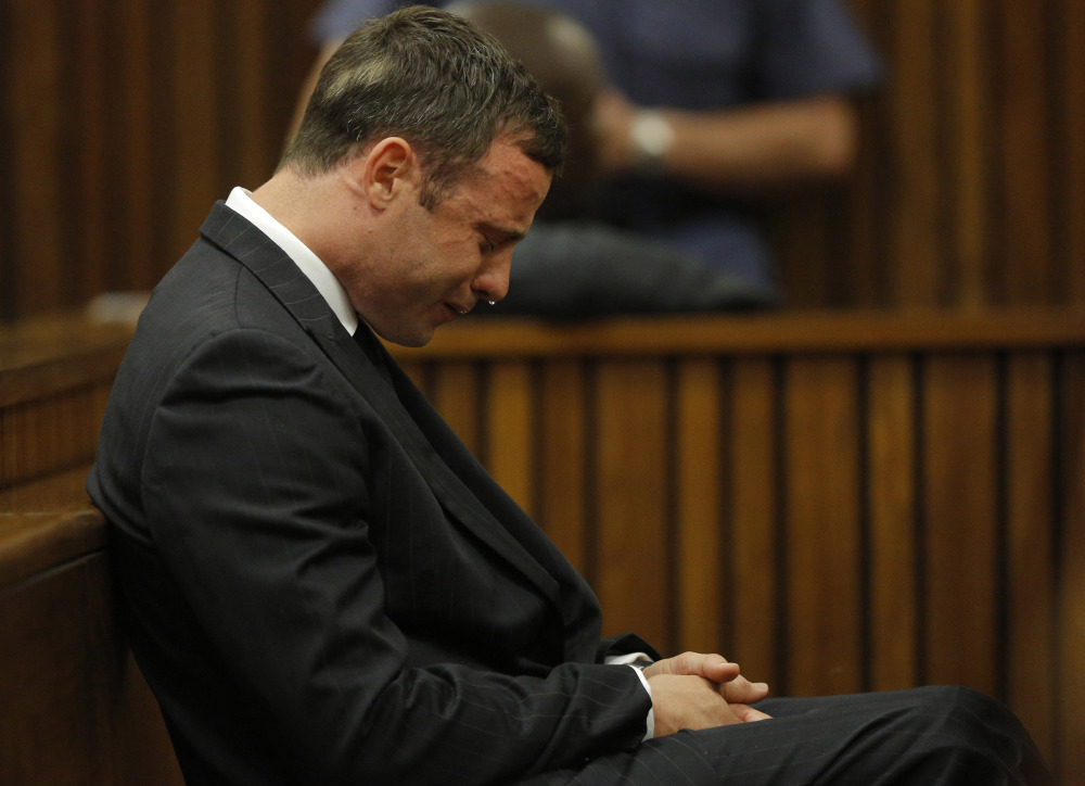 Oscar Pistorius cries in the dock in Pretoria Thursday, as Judge Thokozile Masipa reads notes on her verdict in Pistorius’ murder trial.