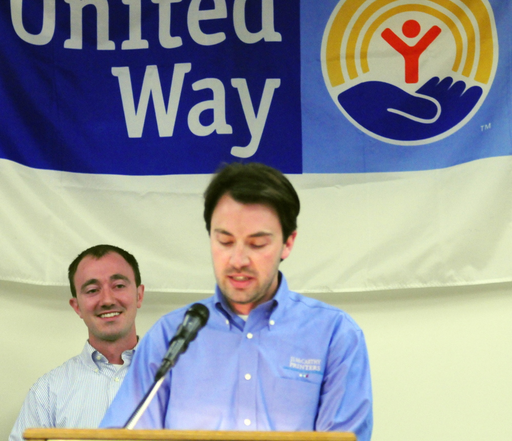 Campaign co-chairmen Michael Tardiff, front, and his brother Matthew Tardiff during the United Way of Kennbec Valley annual campaign kickoff event on Thursday at the Augusta Civic Center. Michael Tardiff compared the work of the United Way agencies to that of a NASCAR pit crew.