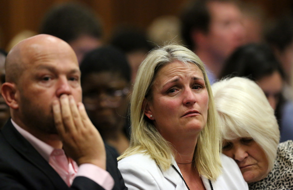 Family members of the late Reeva Steenkamp listen as judgment is passed on Oscar Pistorius in court in Pretoria, South Africa, Friday, Sept. 12, 2014.  Judge Thokozile Masipa found Pistorius guilty of culpable homicide for the shooting death of his girlfriend Reeva Steenkamp.