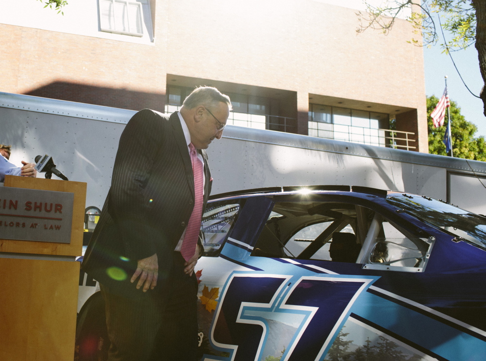 PORTLAND, ME - SEPTEMBER 12:  Maine Governor Paul LePage examines the model of NASCAR driver Austin Theriault's stock car in Portland, ME on Friday, September 12, 2014. The "Maine Car," which is the first public-private sponsored car, was unveiled during a press conference where LePage spoke. Photo by Whitney Hayward/Staff Photographer)