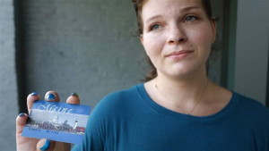 Stormie Whitten, 25, shows her Maine EBT card after shopping for groceries. Portland Press Herald photo