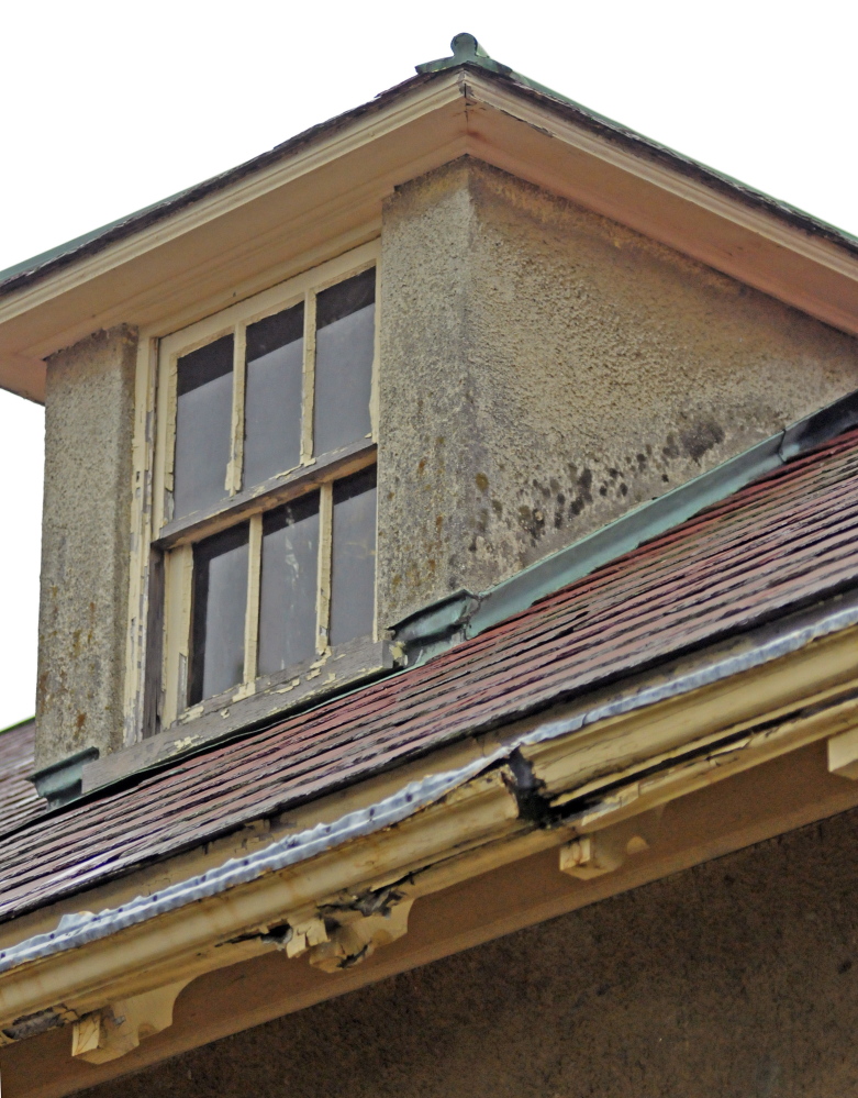 A cracked gutter on the Gannett House shows the deterioration of the 5,000-square-foot building, which has other signs of wear, including water stains on some exterior walls and peeling paint.