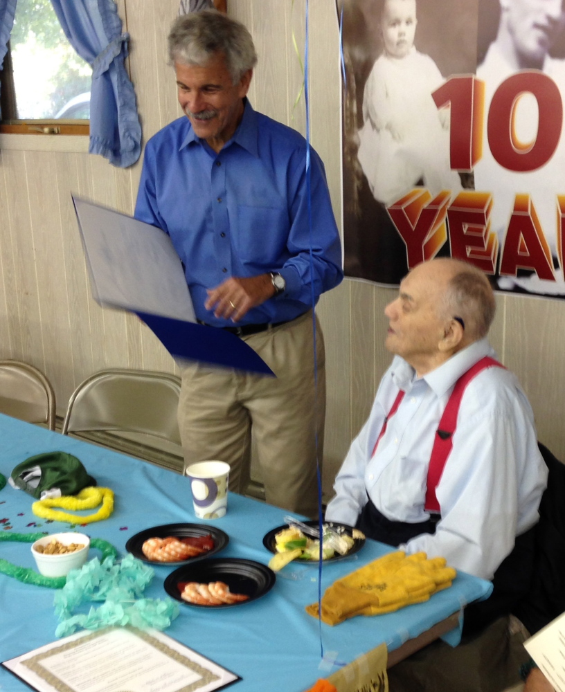 Sen. Roger Katz, R-Kennebec, left, recently presented a legislative sentiment to Kenneth Barden, right, at a party honoring him on his 100th birthday. More than 100 friends and relatives came to the Fox Glen Snowmobile Club to celebrate his life. Barton was the proprietor of Barden’s Shop-Rite in Augusta, which was a local institution. He also had a location in Winthrop.