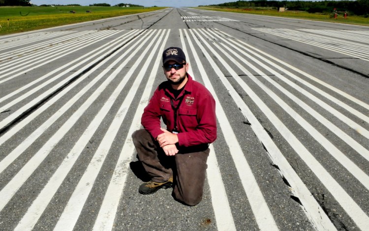 Robert Lafleur Airport Manager Randy Marshall on runway 5/23 at the Waterville airport on Monday. The airport has been awarded a $4.3 million grant to recondition runways and for other work at the airport.