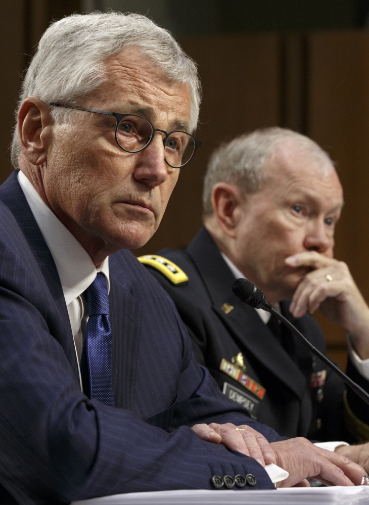 Defense Secretary Chuck Hagel, left, and Army Gen. Martin Dempsey, chairman of the Joint Chiefs of Staff, appear Tuesday before the Senate Armed Services Committee on Capitol Hill in Washington.