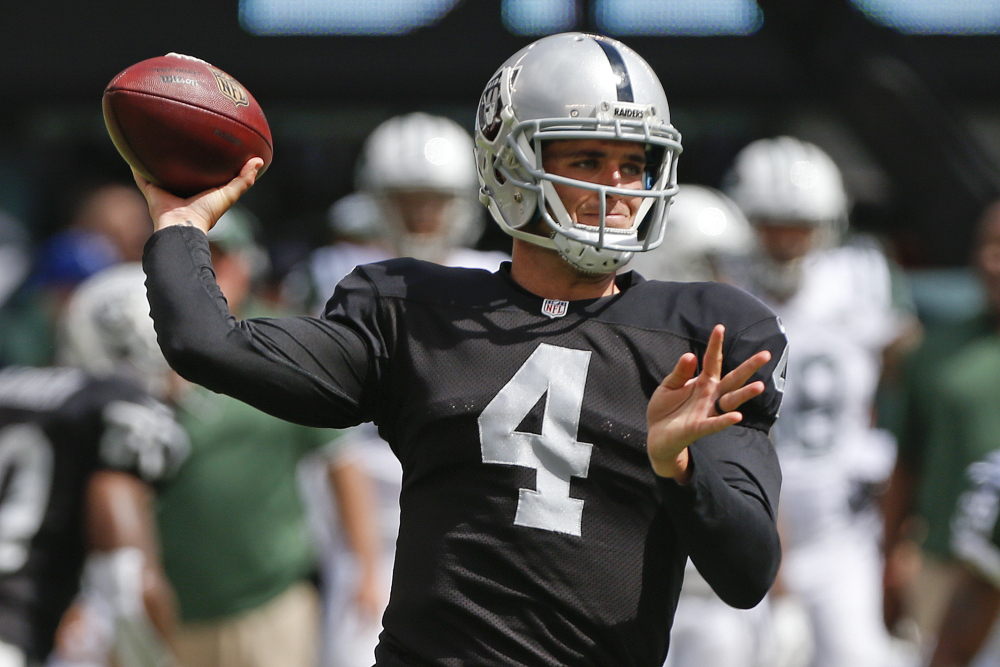 Quarterback Derek Carr (4) and the Oakland Raiders travel to Foxborough, Mass. on Sunday to play against the New England Patriots. Carr, a rookie, has two games of NFL experience.