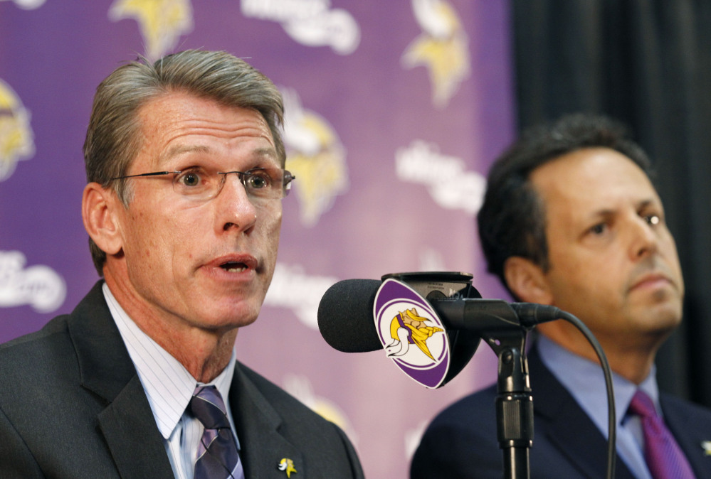 Rick Spielman, the Minnesota Vikings’ executive vice president and general manager, speaks Wednesday as owner-chairman Mark Wilf listens during a news conference in Eden Prairie, Minn. Hours after reversing course and benching Adrian Peterson indefinitely, team owner Zygi Wilf said the team “made a mistake” in bringing back its star running back after his indictment on a child-abuse charge in Texas.