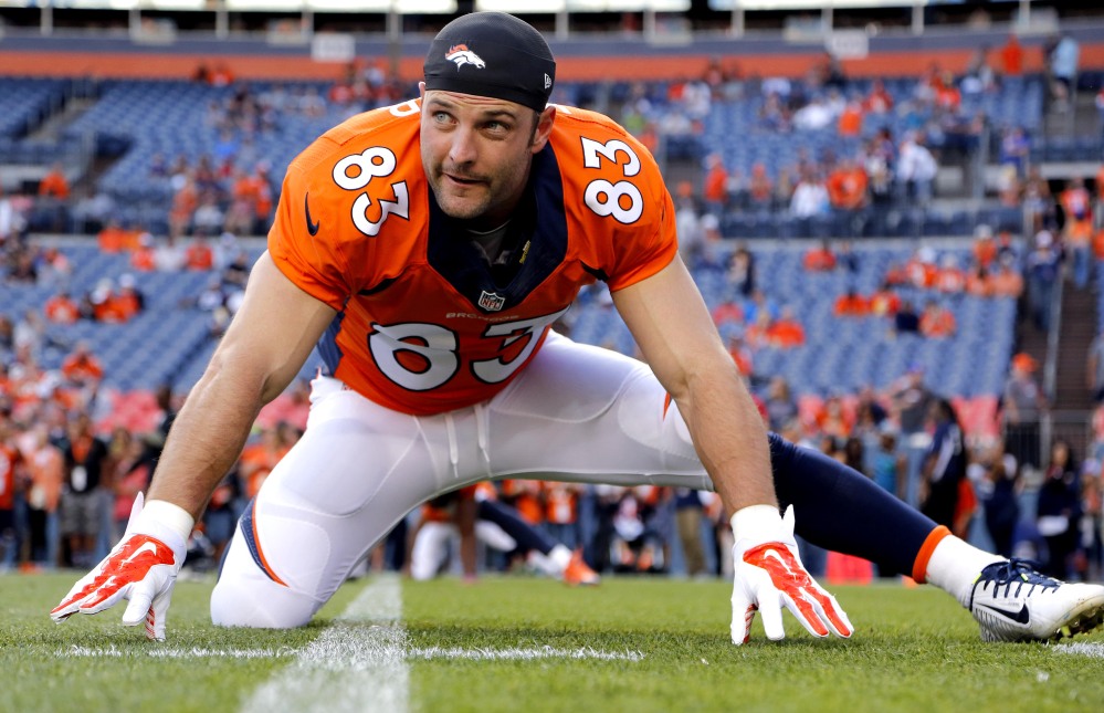 In this file photo, Denver Broncos wide receiver Wes Welker (83) stretches prior to an NFL preseason football game against the Houston Texans in Denver.