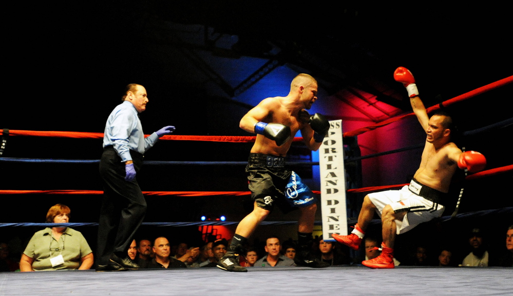 Light welterweight Brandon Berry knocks down Moises Rivera in the second round at the Portland Expo on June 14. Berry scored a technical knockout in the second round to improve his pro record to 6-0.