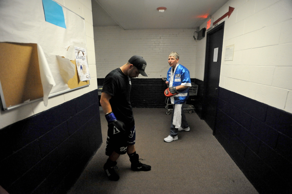 Light welterweight Brandon Berry warms up with his trainer Skeet Wyman for his sixth professional fight at the Portland Expo on June 14. Berry scored a technical knockout of opponent Moises Rivera in the second round to improve his pro record to 6-0.